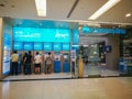The front of Krung Thai or Krungthai Bank Public Company Limited, image showing the ATM machine with customer.